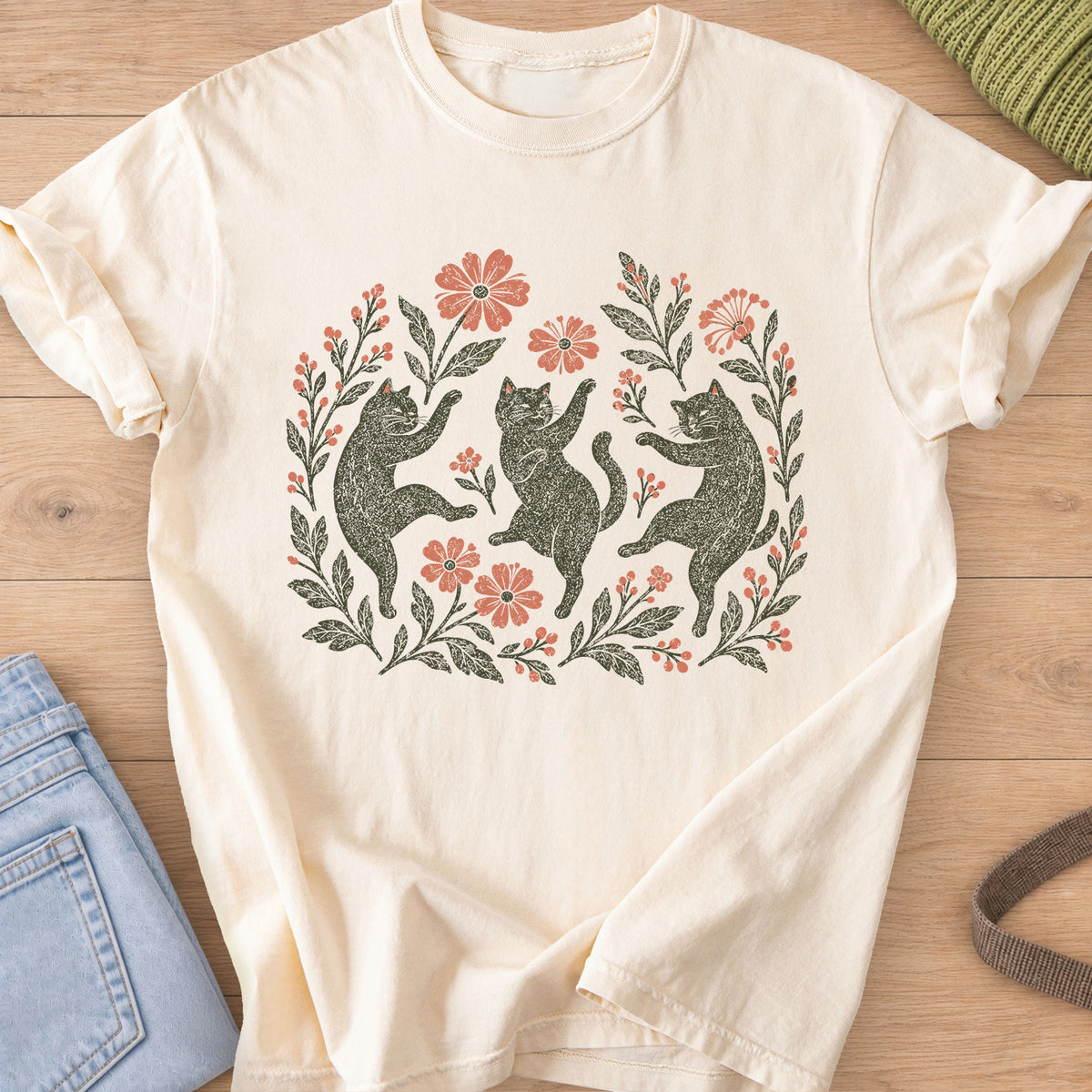 Three cats dancing on their hind legs among flowers, leafy stems and berries, charcoal and coral ink on an Ivory T-Shirt