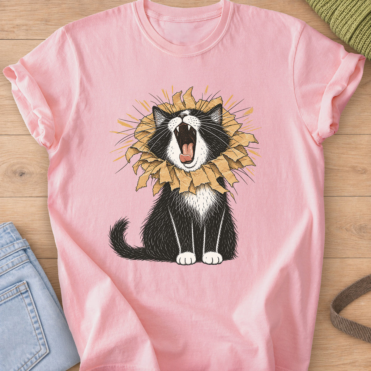 Tuxedo cat roaring with a torn paper bag mane like a lion, sunburst rays behind on a Blossom T-Shirt