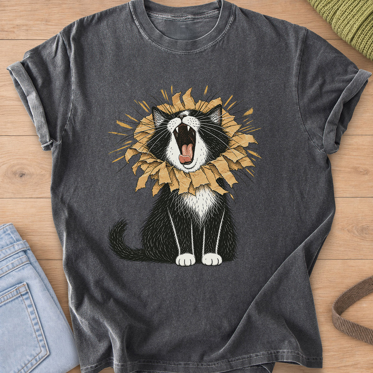 Tuxedo cat roaring with a torn paper bag mane like a lion, sunburst rays behind on a Pepper T-Shirt