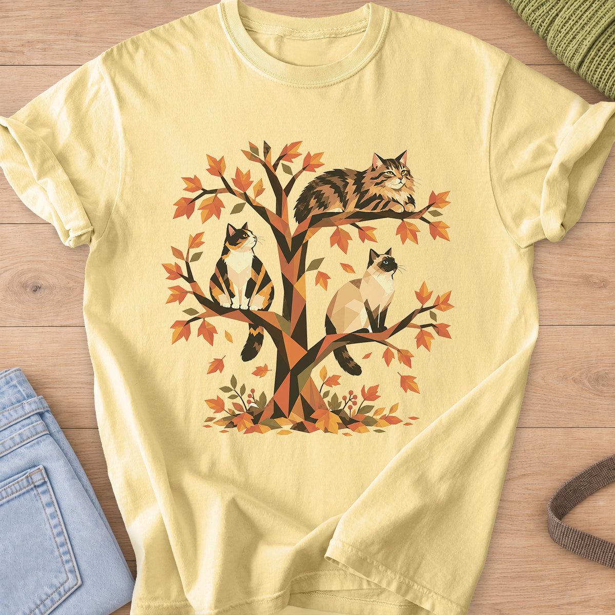 Calico, tabby and Siamese cats perched in a geometric autumn tree with leaves on a Butter T-Shirt