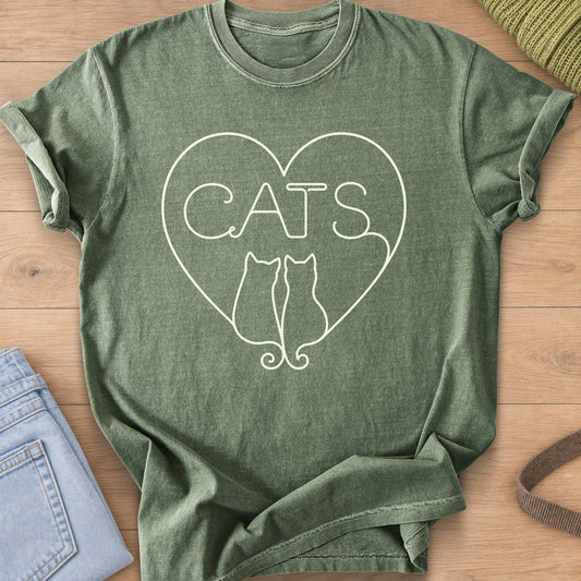 Two cats seen from behind with curled tails below "CATS" inside a heart outline, cream ink on a Moss T-Shirt
