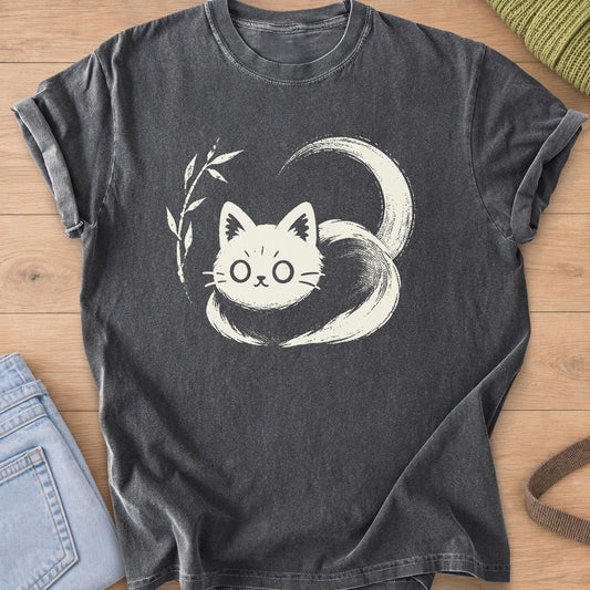 Wide-eyed cat loaf wrapped in a sweeping brushstroke tail beside a bamboo sprig, cream ink on a Pepper T-Shirt