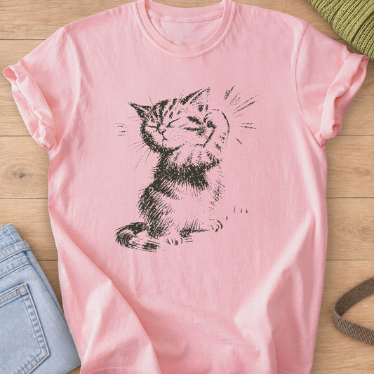 Sketched tabby kitten flexing a raised paw, eyes closed, with burst lines, dark charcoal ink on a Blossom T-Shirt