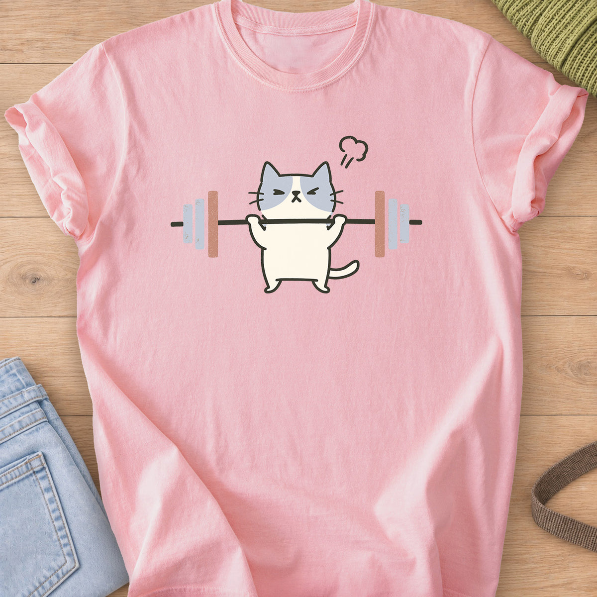 Patched cat squinting as it lifts a barbell, a puff of steam over its head on a Blossom T-Shirt