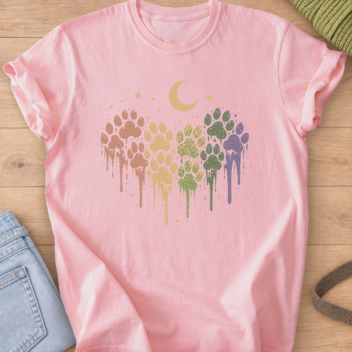 Paw prints in a dripping paint heart under a crescent moon and scattered stars on a Blossom T-Shirt