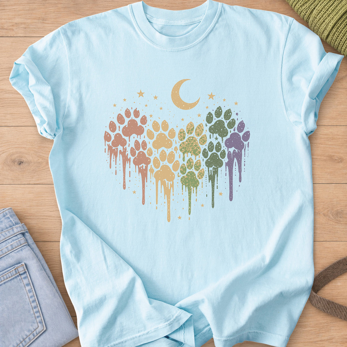 Paw prints in a dripping paint heart under a crescent moon and scattered stars on a Chambray T-Shirt
