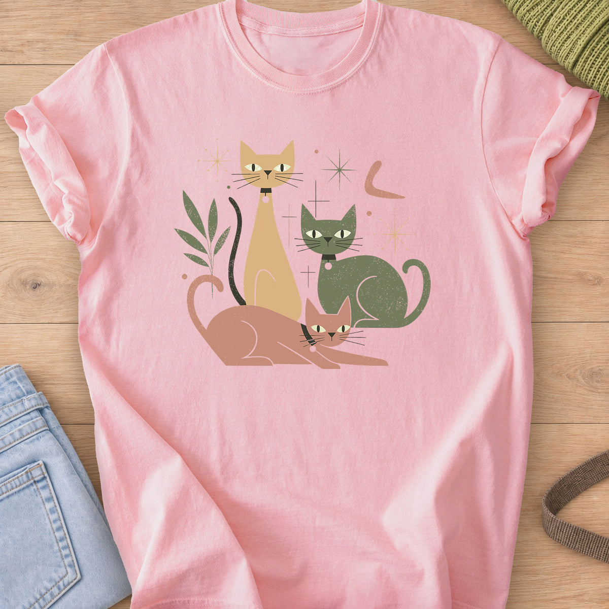 Three mid-century cats with collars posing among starbursts and a leafy sprig on a Blossom T-Shirt